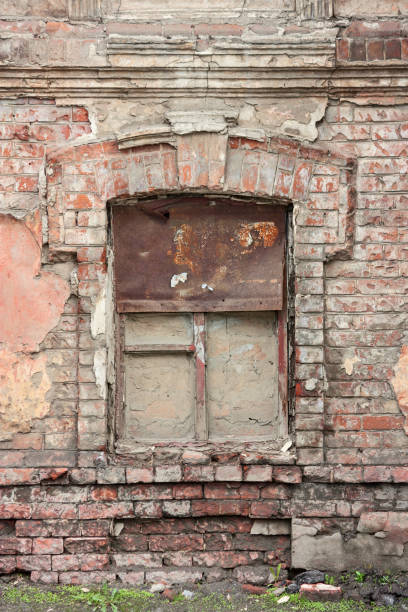istock Old ancient window with old grunge brick wall