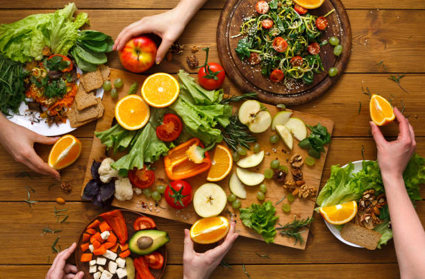 istock Dinner table, women eat healthy food at home kitchen 813655262