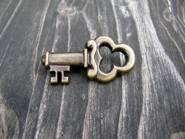 istock Decorative key pin on wooden background 813655758
