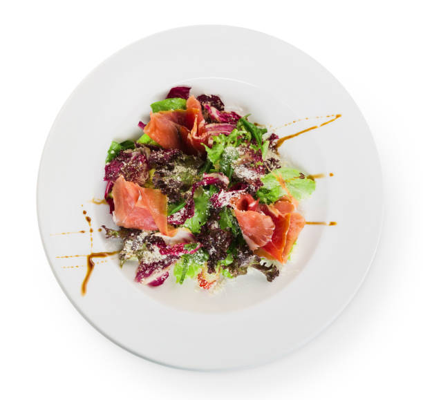 istock Restaurant food closeup - salad with prosciutto and vegetables 813655962