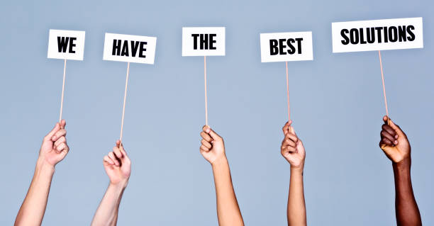 istock Hand-held signs read 