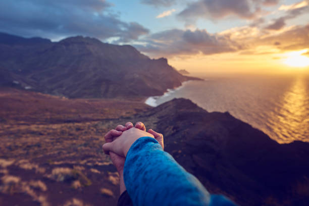 istock holding hands and being together 813658570