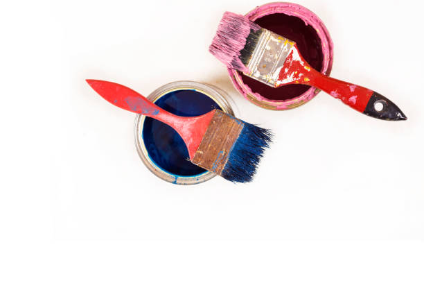 istock Full of blue paint tines and paint brushes on it 813660142