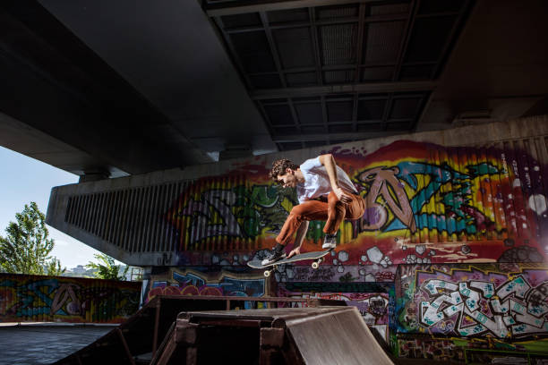 istock Skater jumping on his skate in skatepark 813689498
