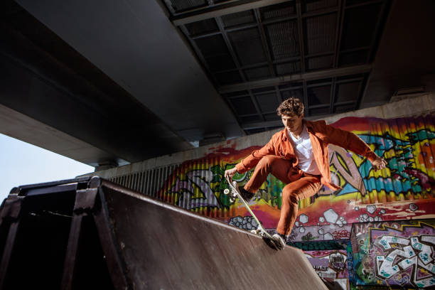 istock Skater jumping on his skate in skatepark 813690180