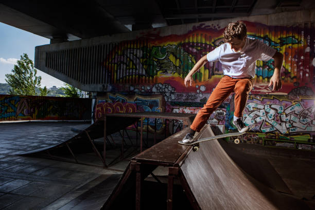 istock Skater jumping on his skate in skatepark 813690192