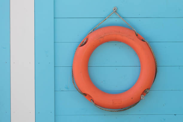istock Red life buoy hanging 813692298