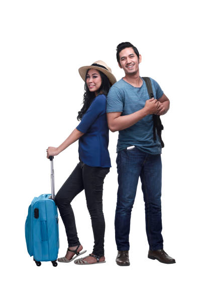 Traveler asian couple with backpack and suitcase standing Traveler asian couple with backpack and suitcase standing isolated over white background happy malay couple stock pictures, royalty-free photos & images