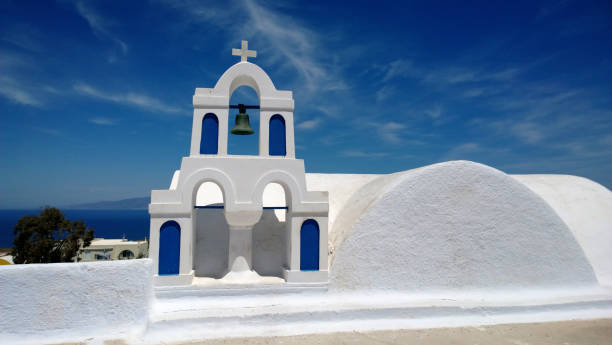 istock Blue and white bell tower at Santorini - Oia 813697890