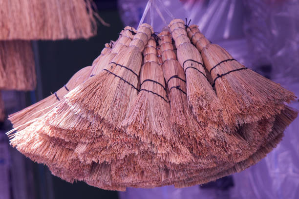 istock Set of yellow straw broom in bazaar 813698464