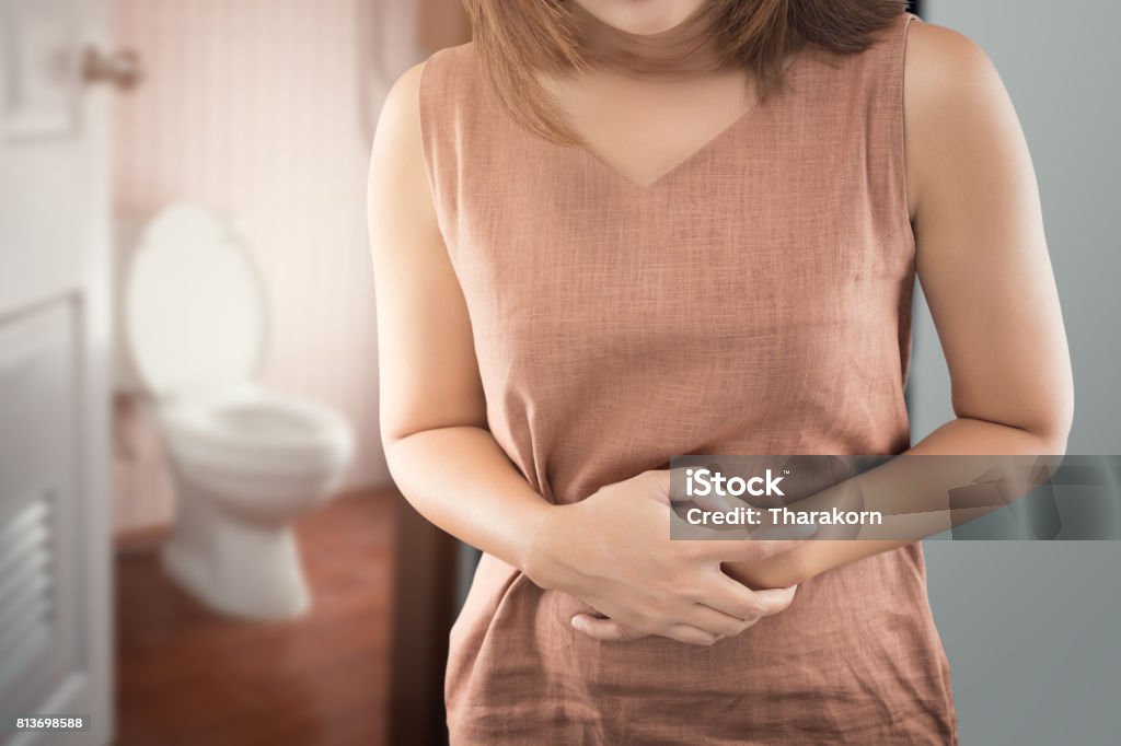 The woman wake up for go to restroom. People with diarrhea problem concept Constipation Stock Photo