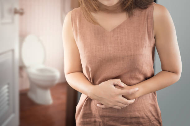 The woman wake up for go to restroom. People with diarrhea problem concept stock photo