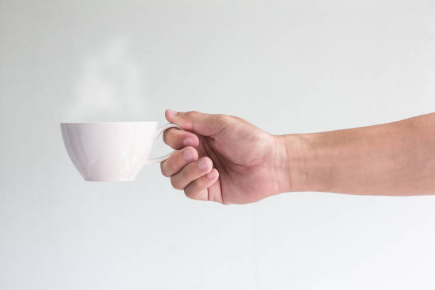 istock cup of coffee in man hand 813702994
