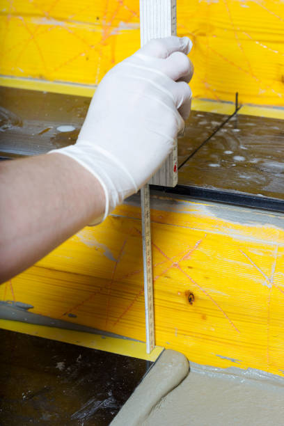 istock measuring of a stair with folding rule 813703084