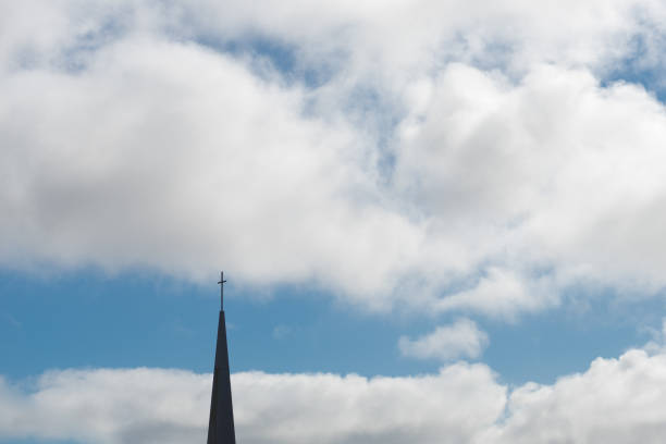istock Church steeple with a cross 813708474