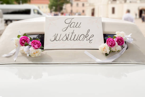 istock White wedding limousine decorated with flowers 813708502