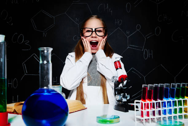 Shocked girl at her laboratory Shocked girl at her laboratory blackboard child shock screaming stock pictures, royalty-free photos & images