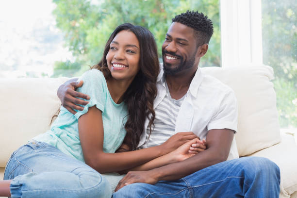 istock Happy couple on the couch 813720078
