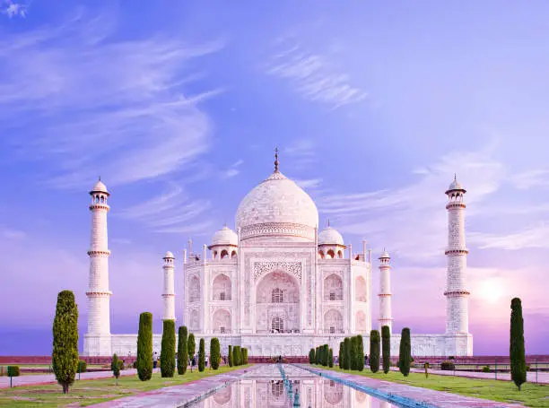 Amazing view on the Taj Mahal in sunrise light. The Taj Mahal is an ivory-white marble mausoleum on the south bank of the Yamuna river. Agra, Uttar Pradesh, India.