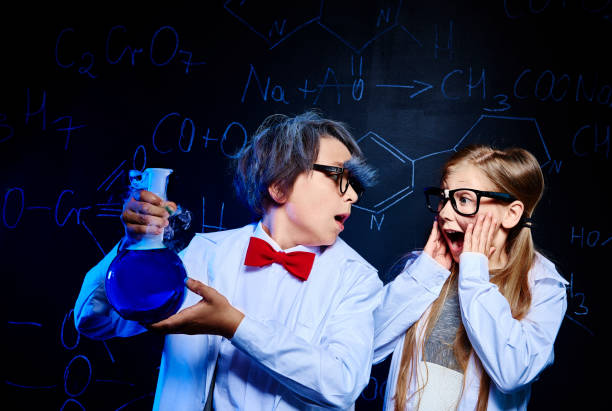 Shocked little chemists in laboratory Shocked little chemists in laboratory blackboard child shock screaming stock pictures, royalty-free photos & images