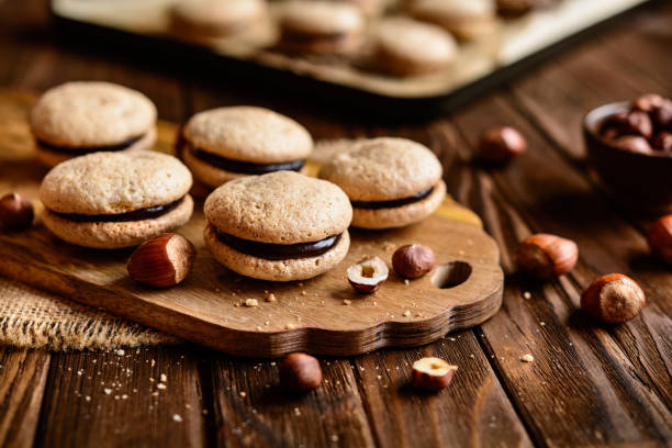 Hazelnut shortbread sandwiches filled with chocolate cream