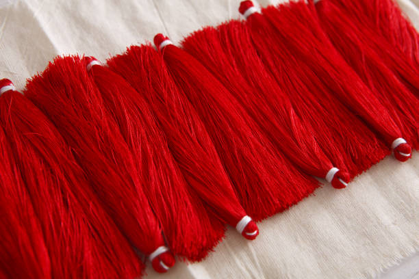 istock Red tassels line close up 813736862