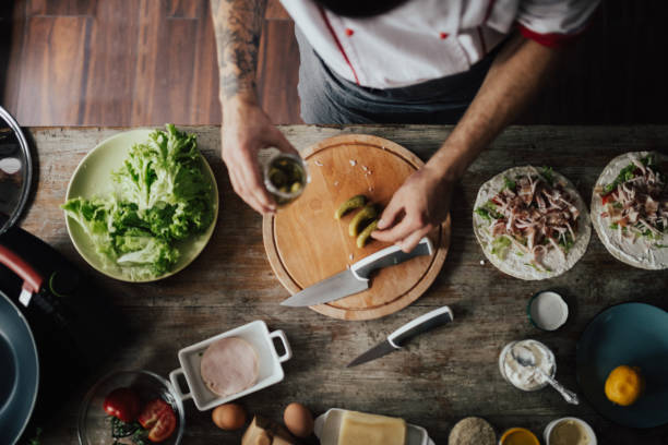 istock The cook is placing pickles on the chopping board 813740434