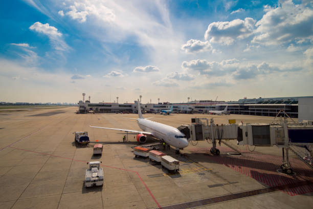 istock airplane ready for boarding in a airport hub at blue sky 813743908