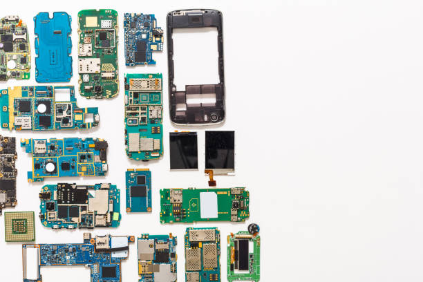 Multimeter and broken mobile electronics at repair shop
