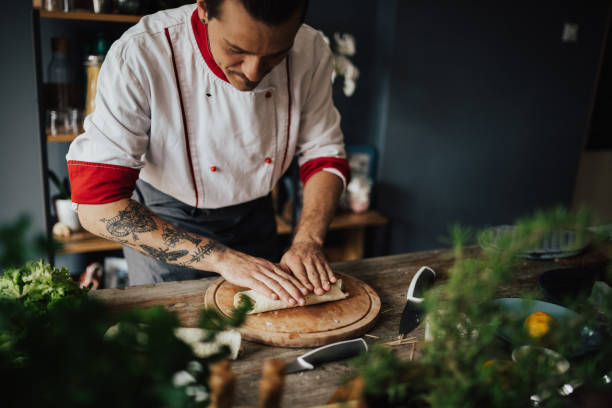 istock Beautiful cook is making a wrap sandwich 813747126