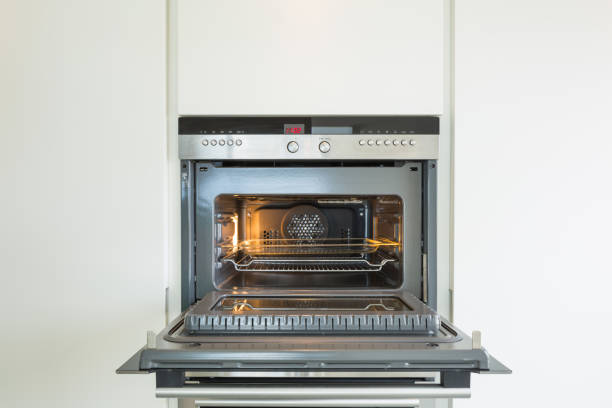 detail of new oven.  door is open and light is on