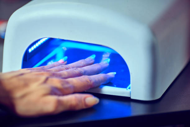 istock Beautician file nails to a customer . 813768776