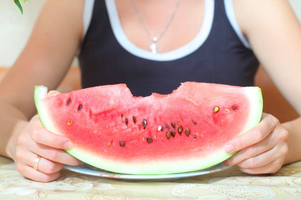 istock Cut watermelon with a knife on the table 813768826