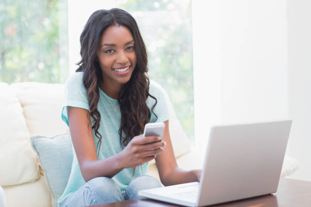 istock Happy woman using her laptop 813769540