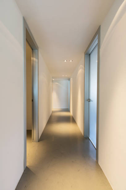 istock Trick of light in white corridor 813772294