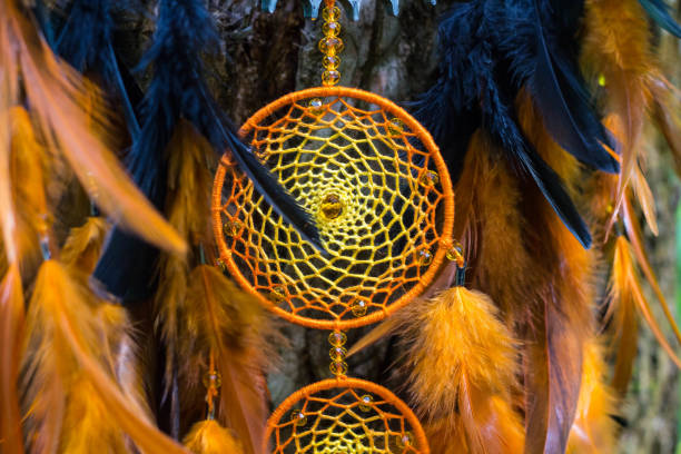 istock Dreamcatcher made of feathers, leather, beads, and ropes 813785828