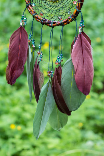 istock Dreamcatcher made of feathers, leather, beads, and ropes 813785962
