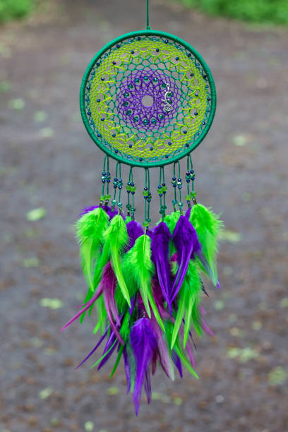 istock Dreamcatcher made of feathers, leather, beads, and ropes 813785992