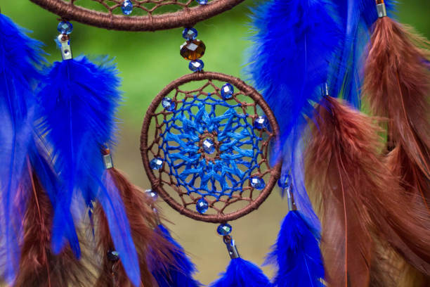 istock Dreamcatcher made of feathers, leather, beads, and ropes 813786034