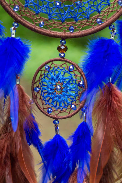 istock Dreamcatcher made of feathers, leather, beads, and ropes 813786042