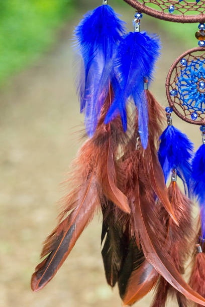 istock Dreamcatcher made of feathers, leather, beads, and ropes 813786086