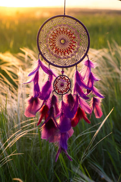 istock Dreamcatcher made of feathers, leather, beads, and ropes 813786138