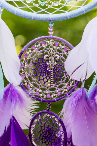 istock Dreamcatcher made of feathers, leather, beads, and ropes 813786594