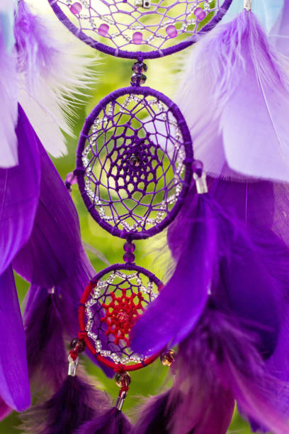 istock Dreamcatcher made of feathers, leather, beads, and ropes 813786598