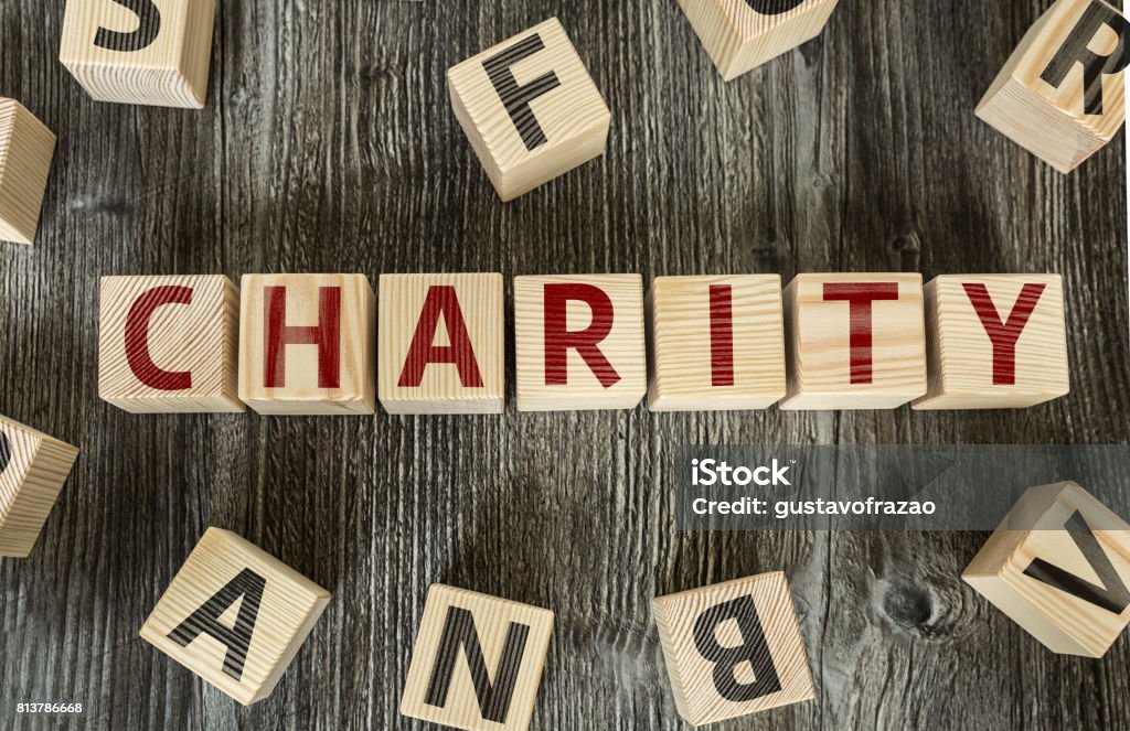 Charity Charity toy blocks A Helping Hand Stock Photo