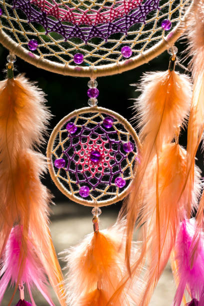istock Dreamcatcher made of feathers, leather, beads, and ropes 813786704