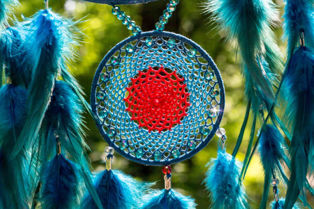 istock Dreamcatcher made of feathers, leather, beads, and ropes 813786728