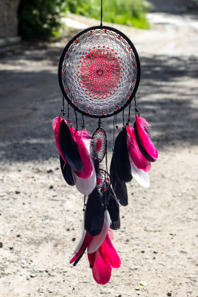 istock Dreamcatcher made of feathers, leather, beads, and ropes 813786870
