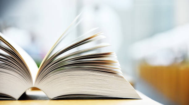 istock Books lying on the table in the public library 813799362