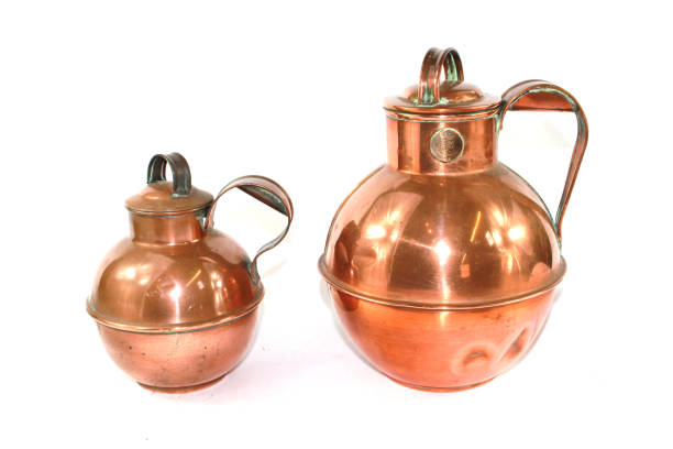 istock Vintage Copper Brass Water Jugs on White Background 813800304